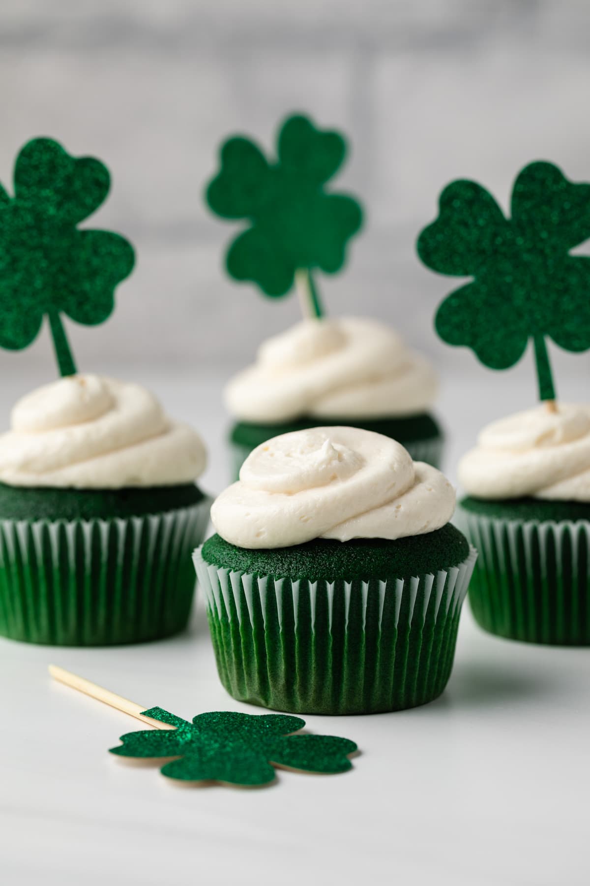 Green velvet cupcakes on countertop.