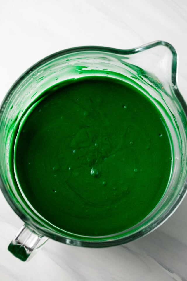Green cake batter in glass bowl.