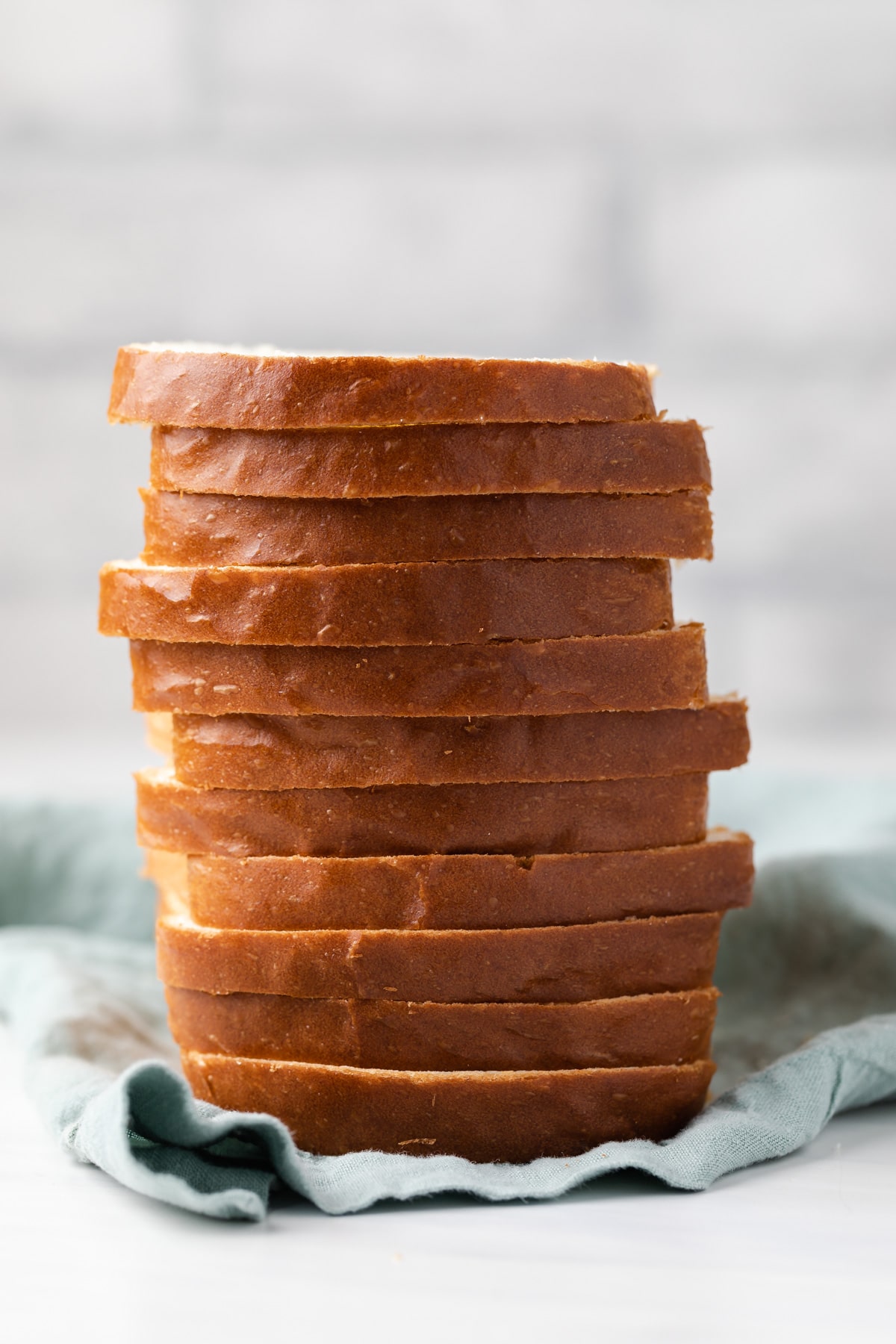 whole loaf of homemade white bread sliced and stacked