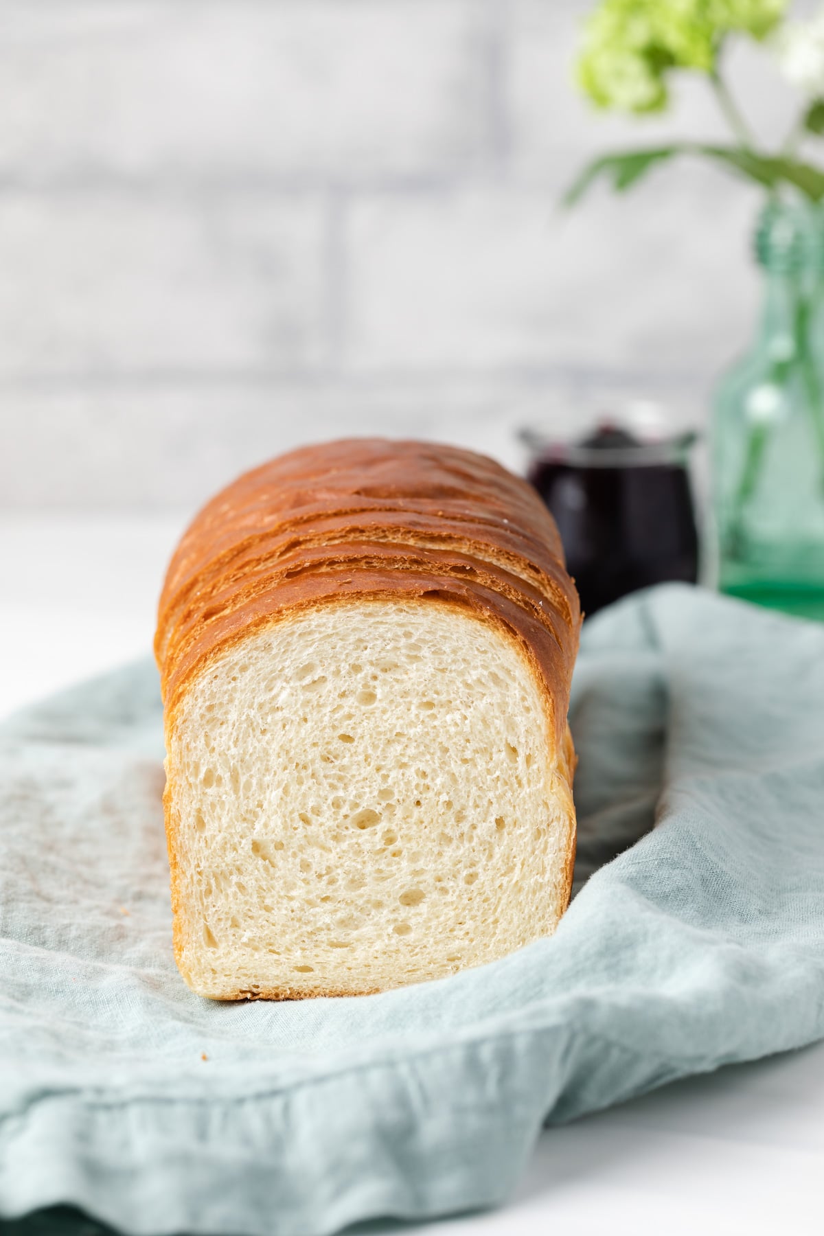 loaf of homemade bread with slice taken out so open face is visible
