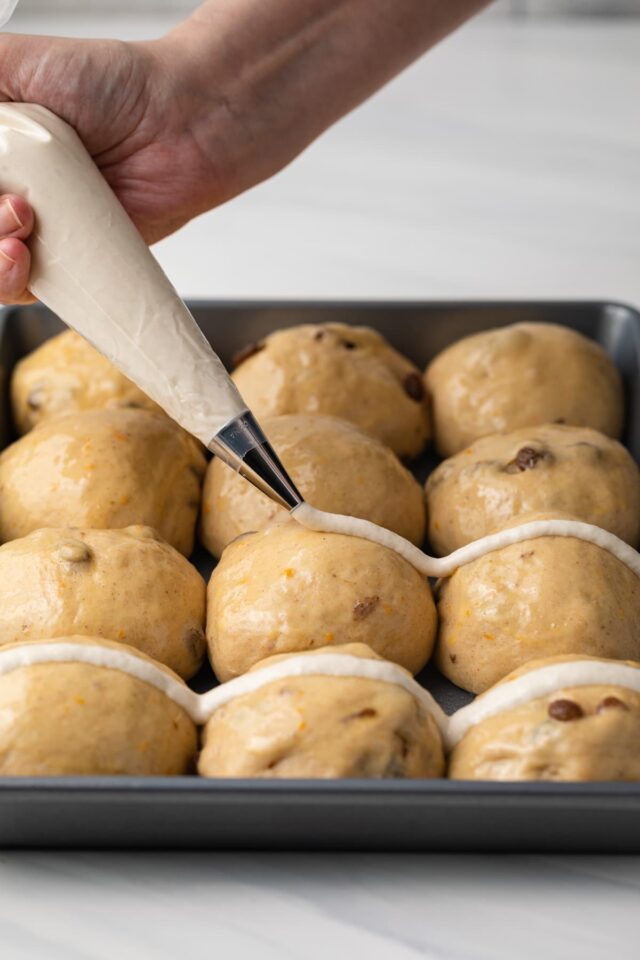 Shaped buns in baking pan.
