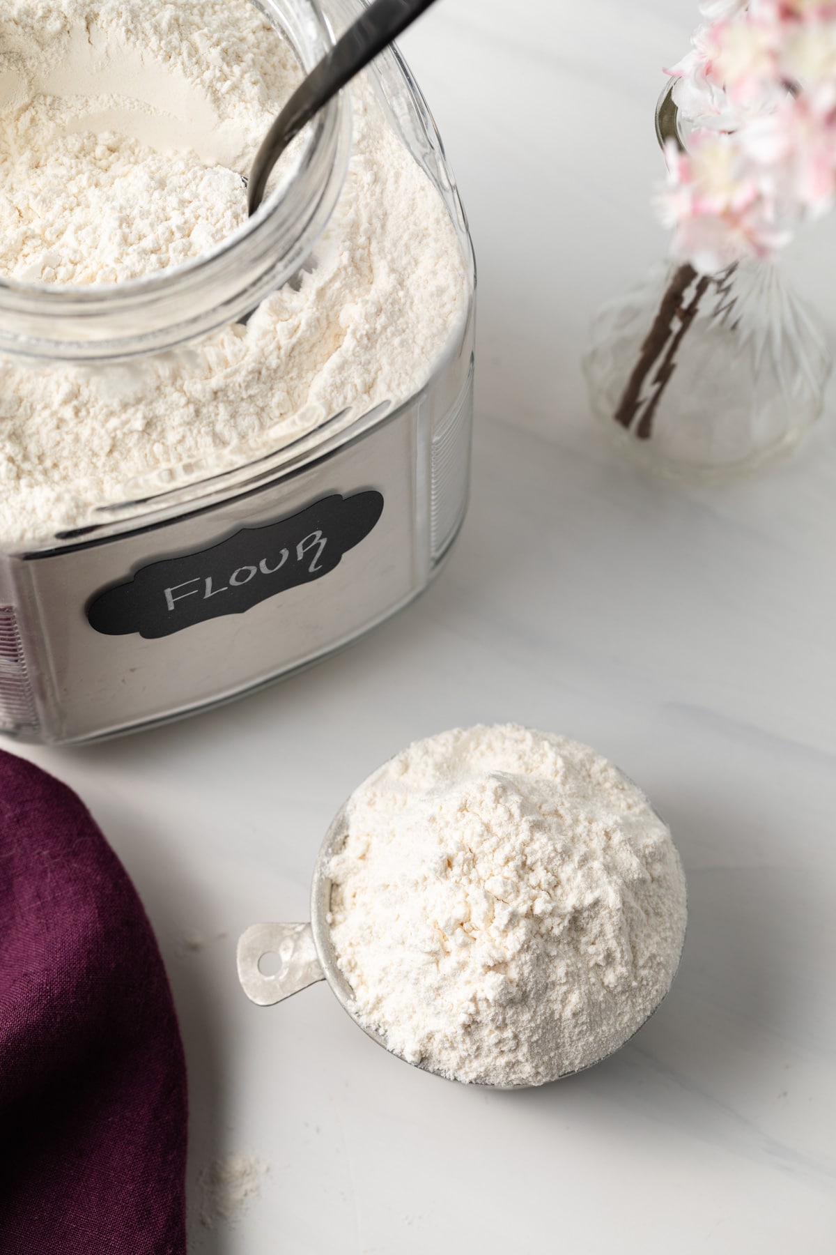 Overhead of baked flour in a measuring cup.