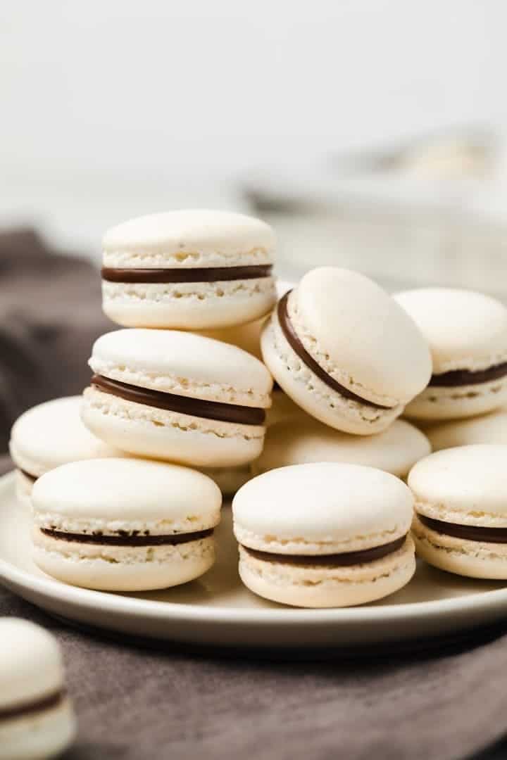 french maracons filled with nutella on a white plate
