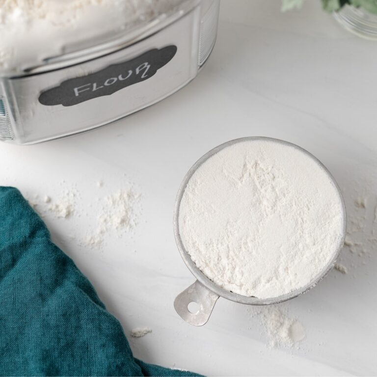 overhead of leveled measuring cup of flour
