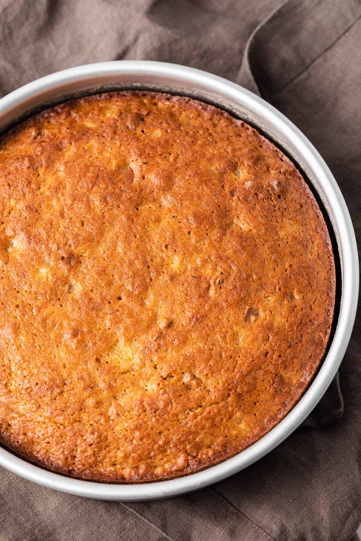 baked hummingbird cake in round cake pan