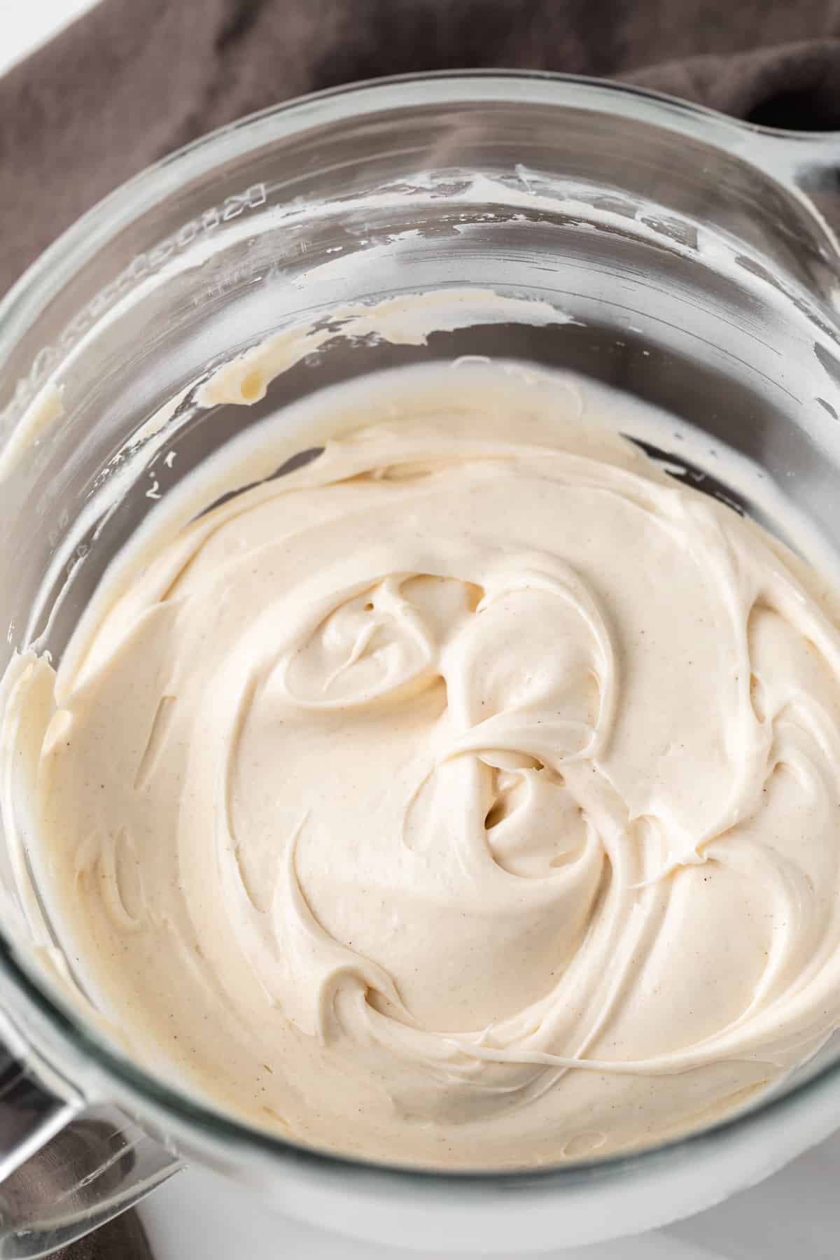 cream cheese frosting in glass bowl