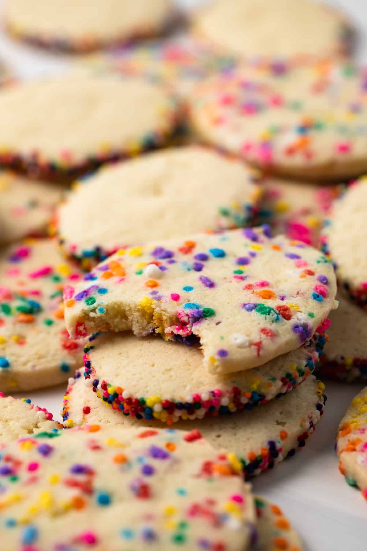 Icebox cookies with a bite taken out of one.