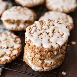 angled view of old fashioned iced oatmeal cookies on a wire rack