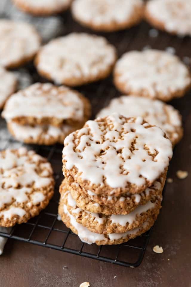 angled view of old fashioned iced oatmeal cookies on a wire rack