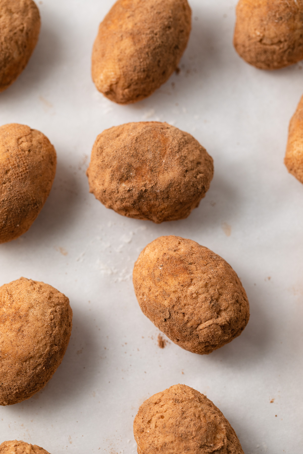 Close up of potato candy on parchment paper.