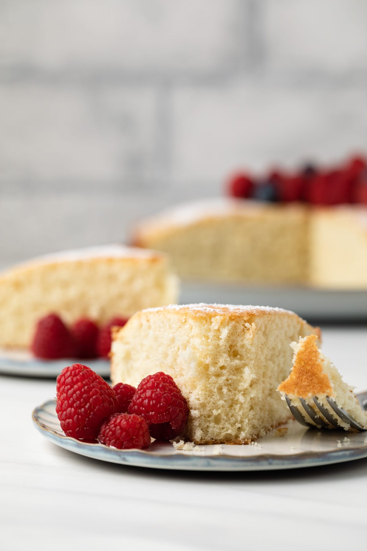 Slice of Irish tea cake with fork taking a bite out.