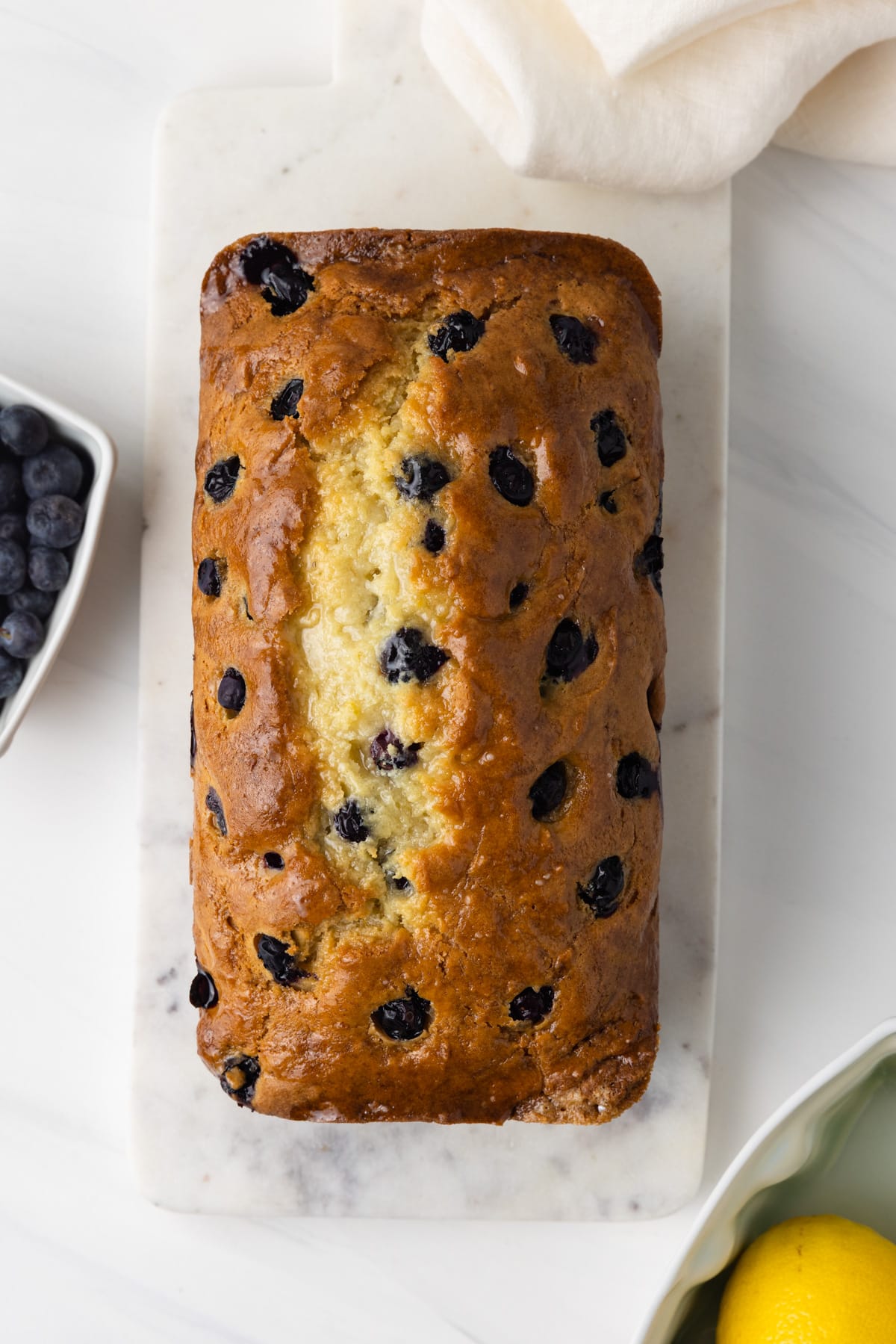 Overhead of glazed lemon blueberry bread.