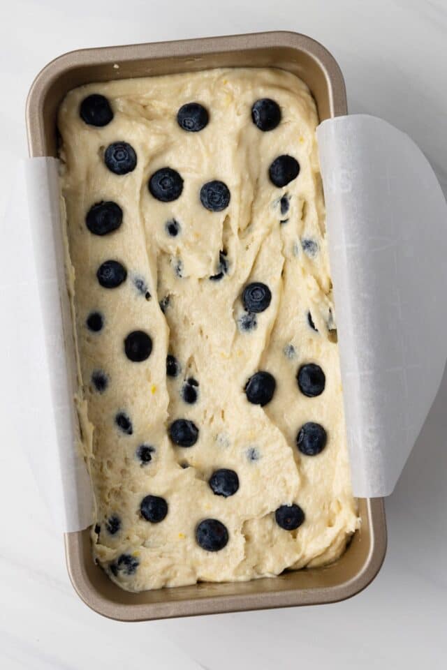 Lemon blueberry batter in loaf pan.