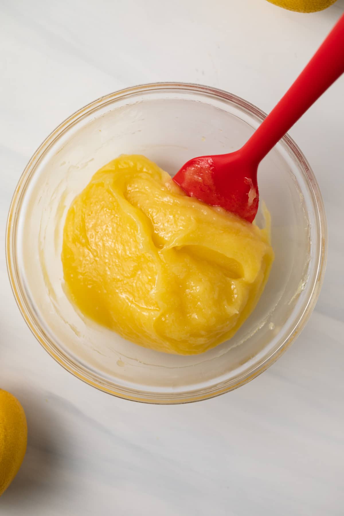 Lemon curd in glass bowl.