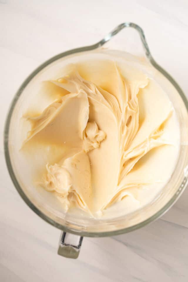 Lemon cream cheese frosting in glass bowl.