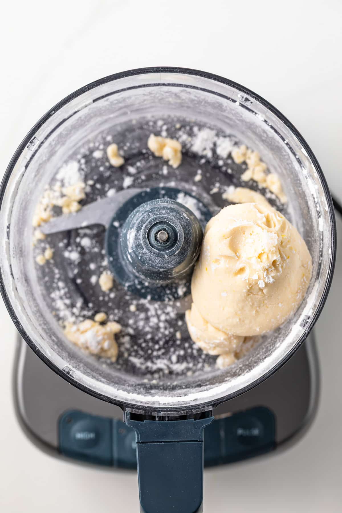 Lemon cookie dough in a food processor.
