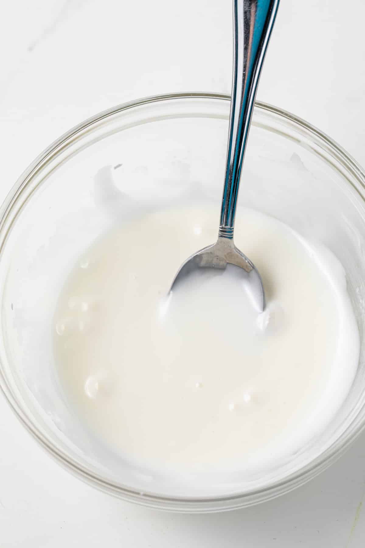 Lemon icing in a bowl.