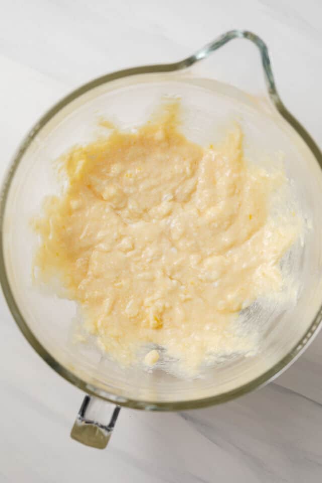 Wet ingredients mixed in glass bowl.