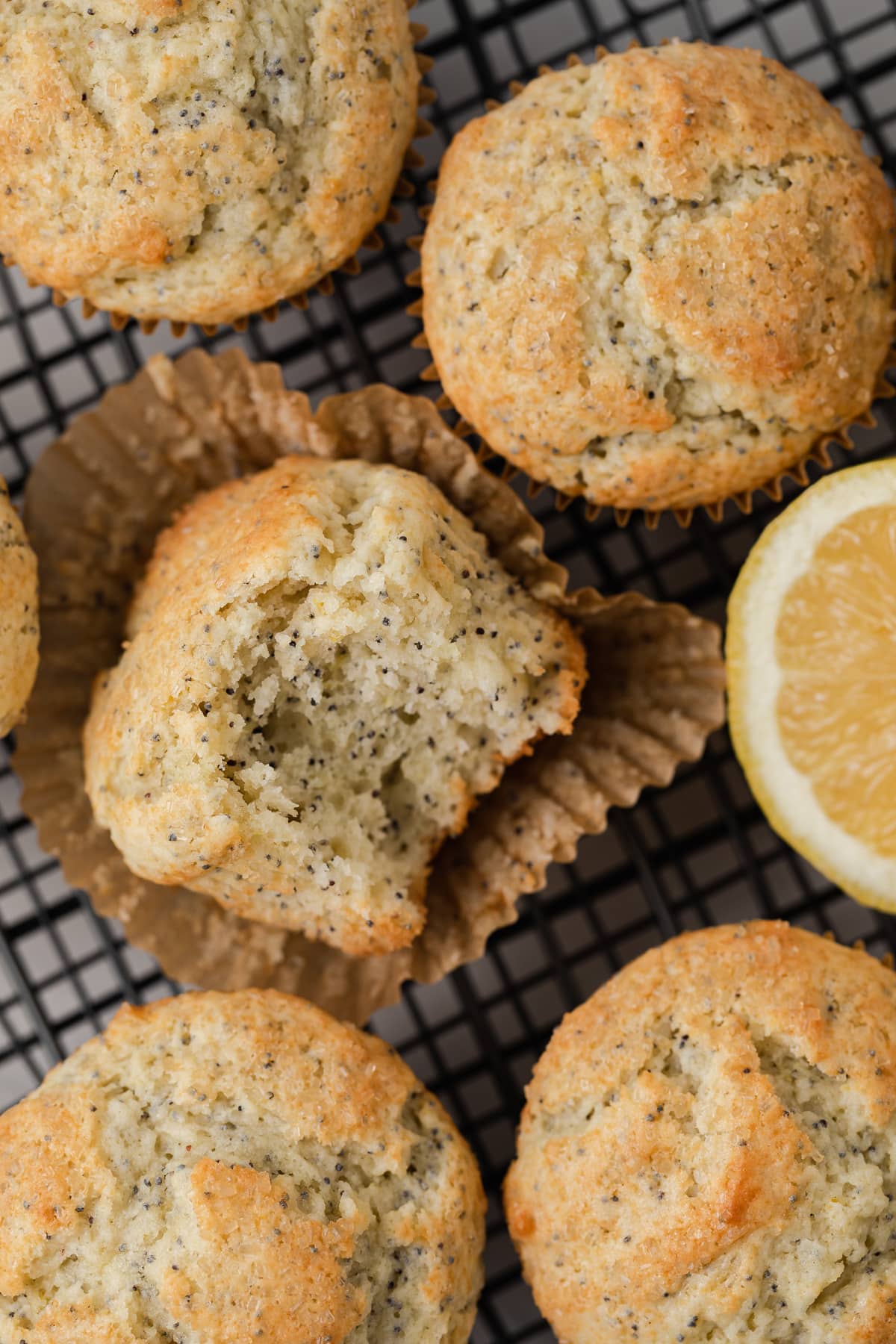 Bite taken out of lemon poppy seed muffin.