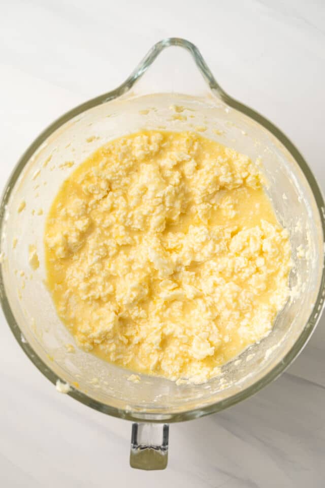 Curdled wet ingredients in mixing bowl.