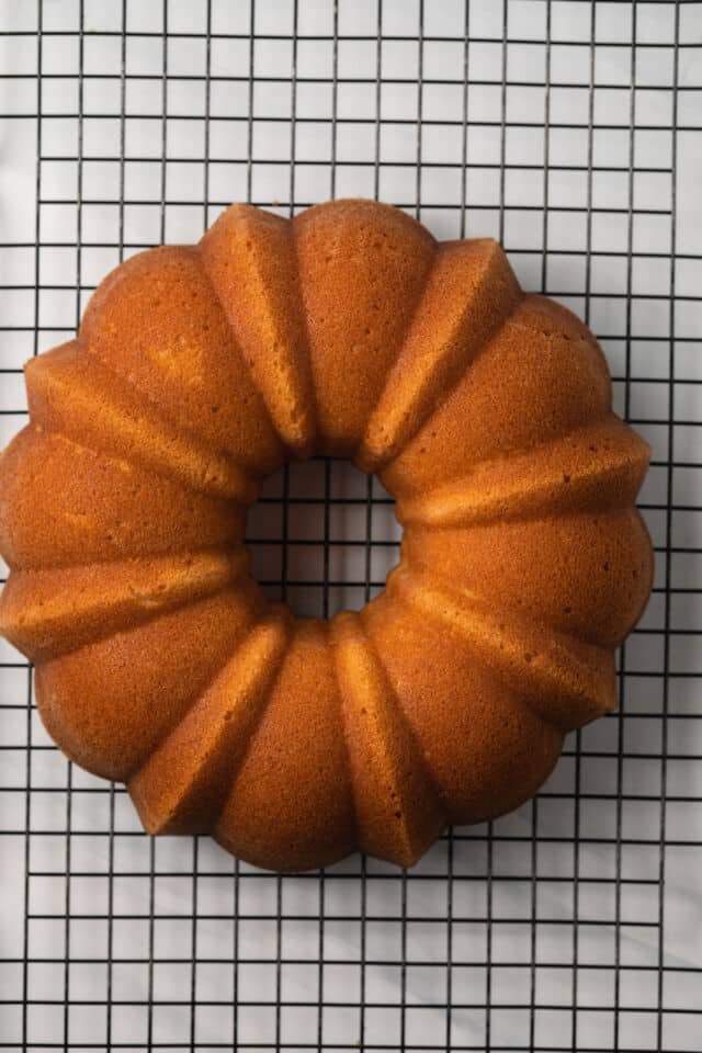 Lemon pound cake on wire rack.