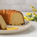 Side view of lemon pound cake with slices taken out.