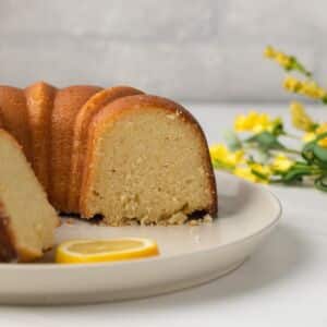 Side view of lemon pound cake with slices taken out.