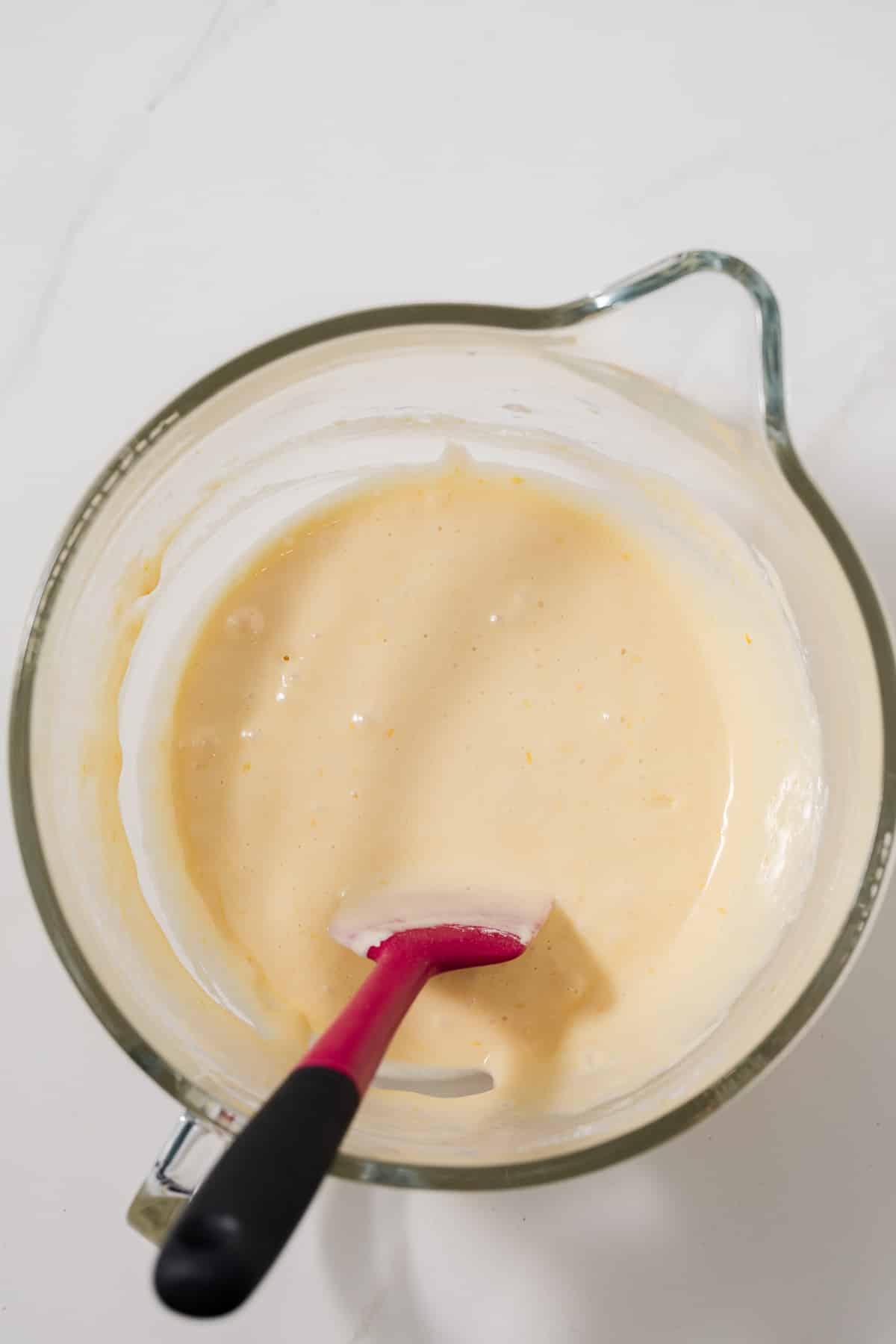 Madeleine batter in glass bowl.