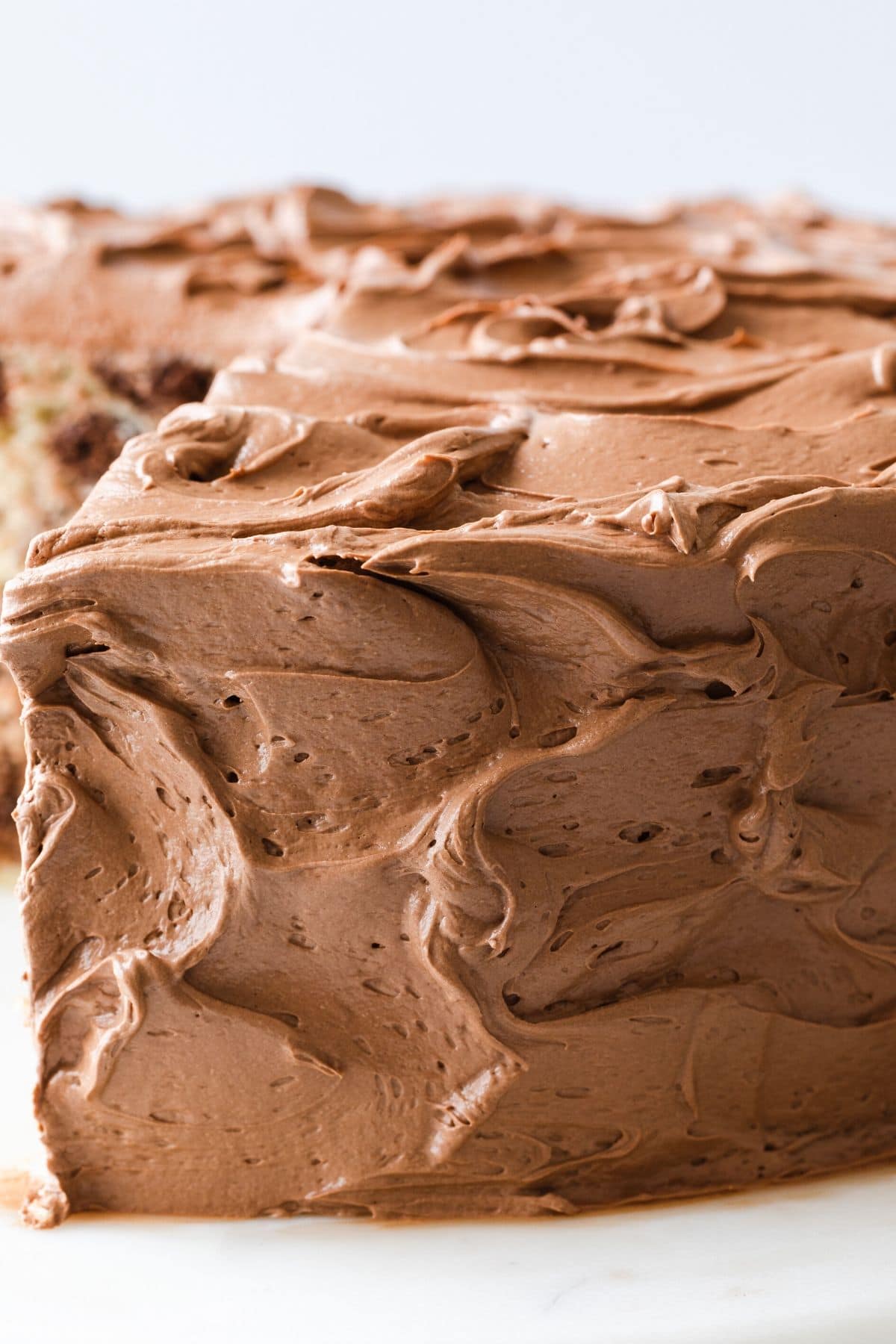 close up of whipped chocolate frosting on cake