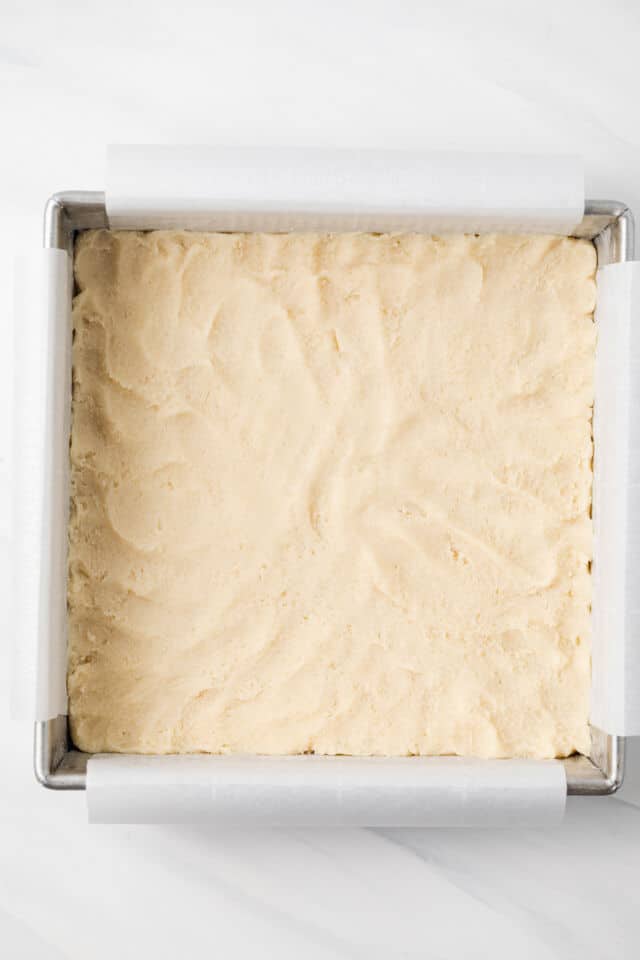 Shortbread dough pressed in baking pan.