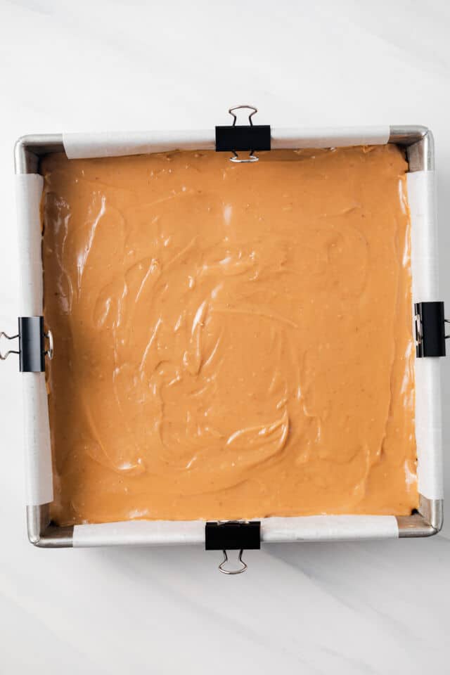 Caramel over shortbread layer.