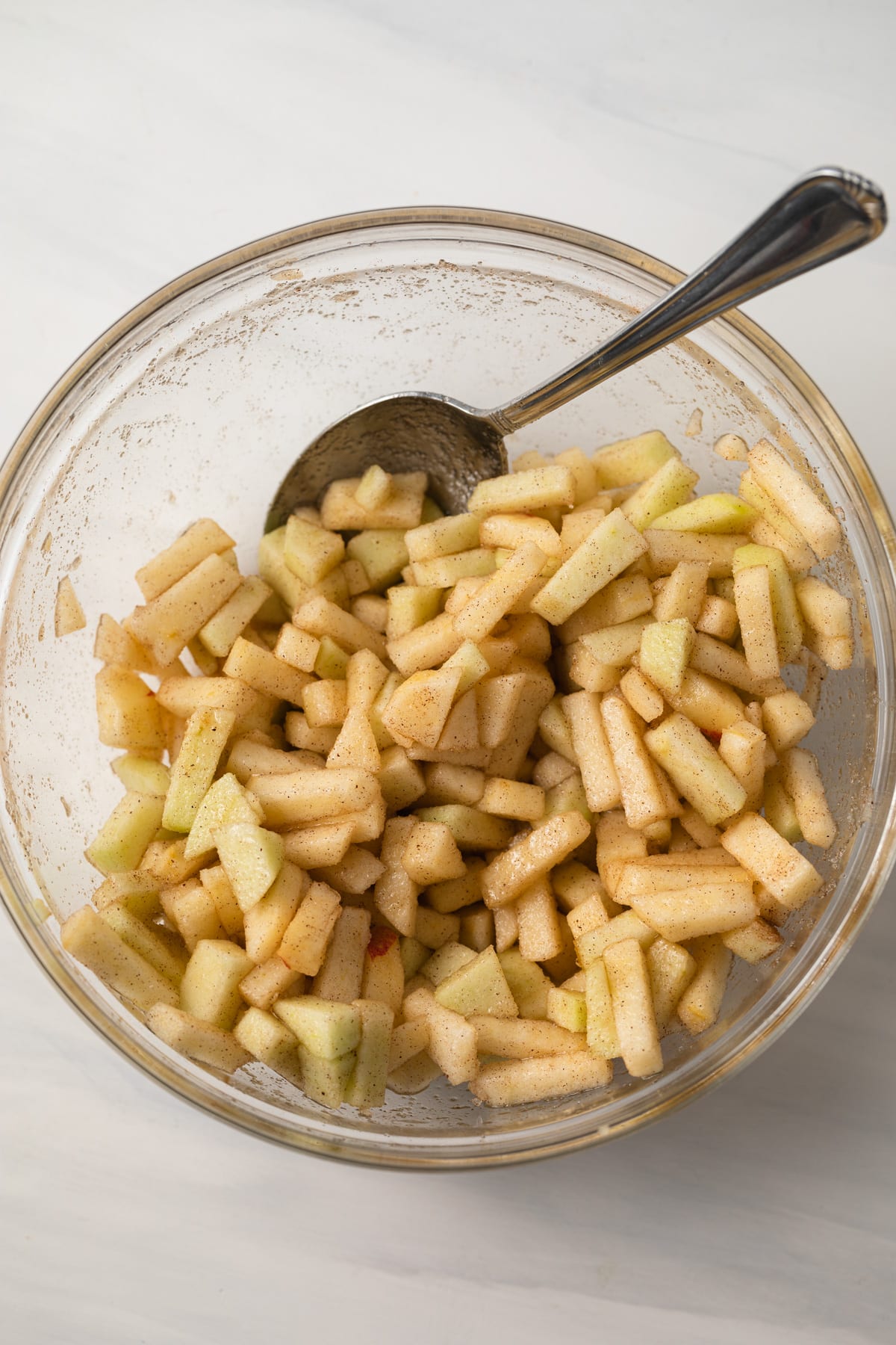 Apple pie filling in a glass bowl.