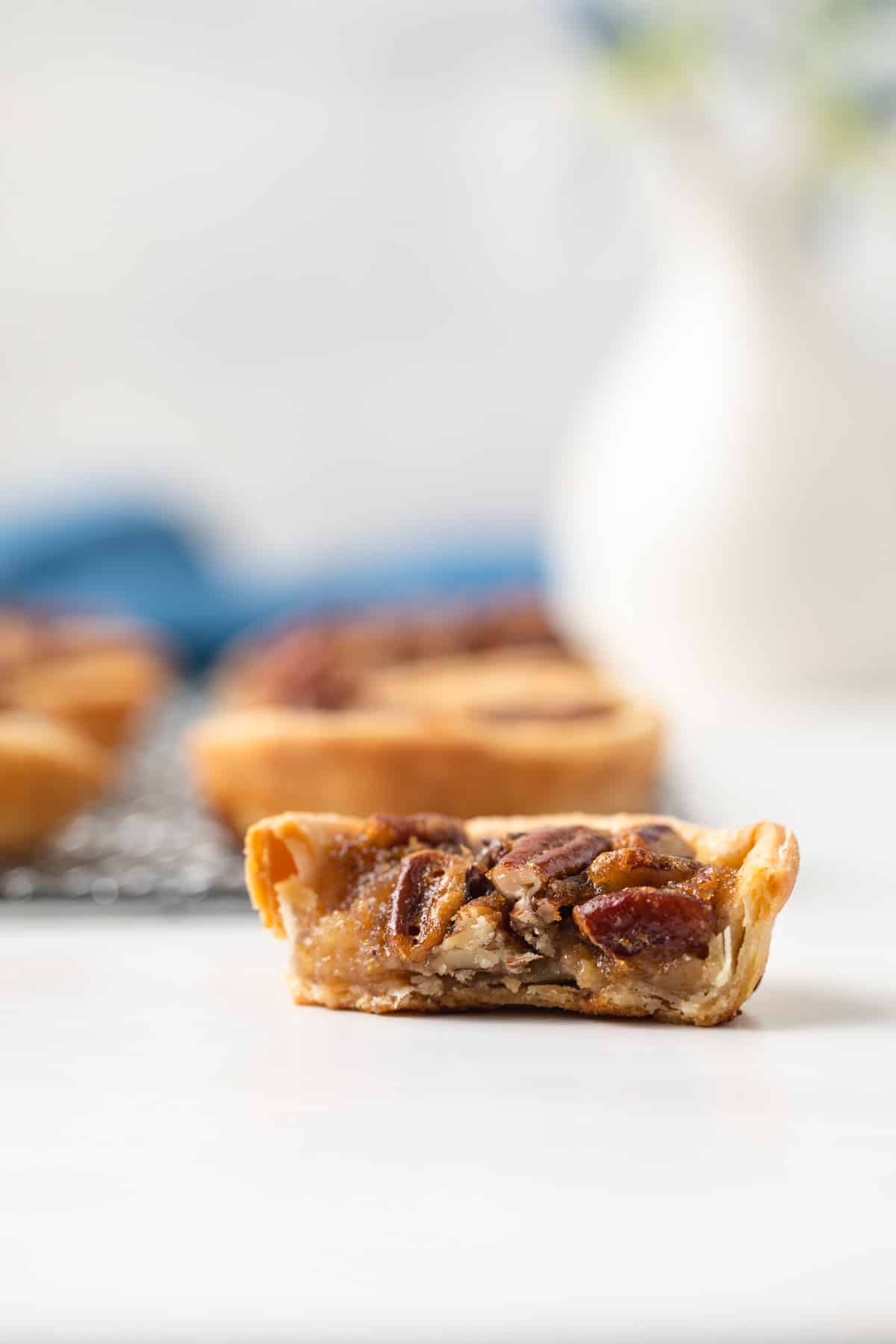 Mini pecan pie cut in half.