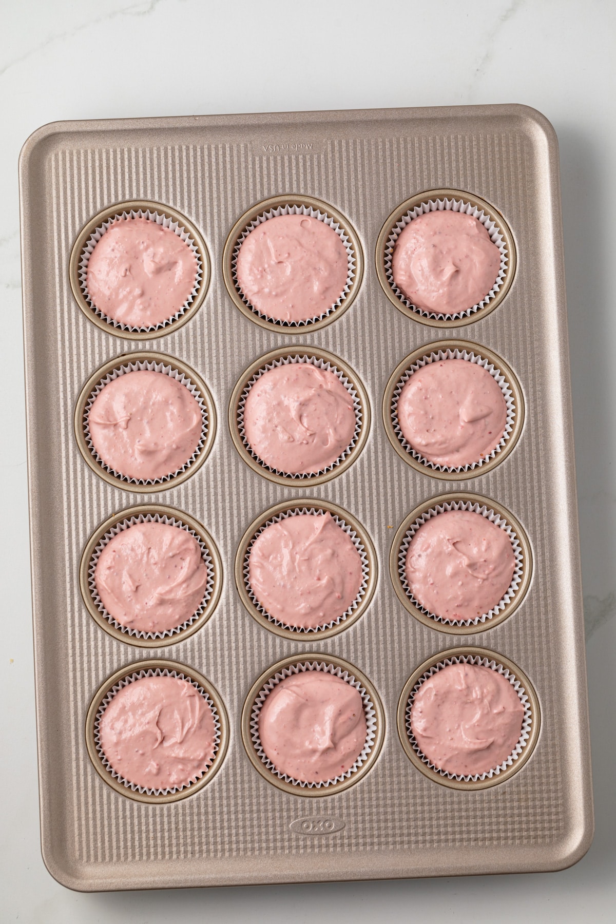 Mini cheesecakes in muffin pan.
