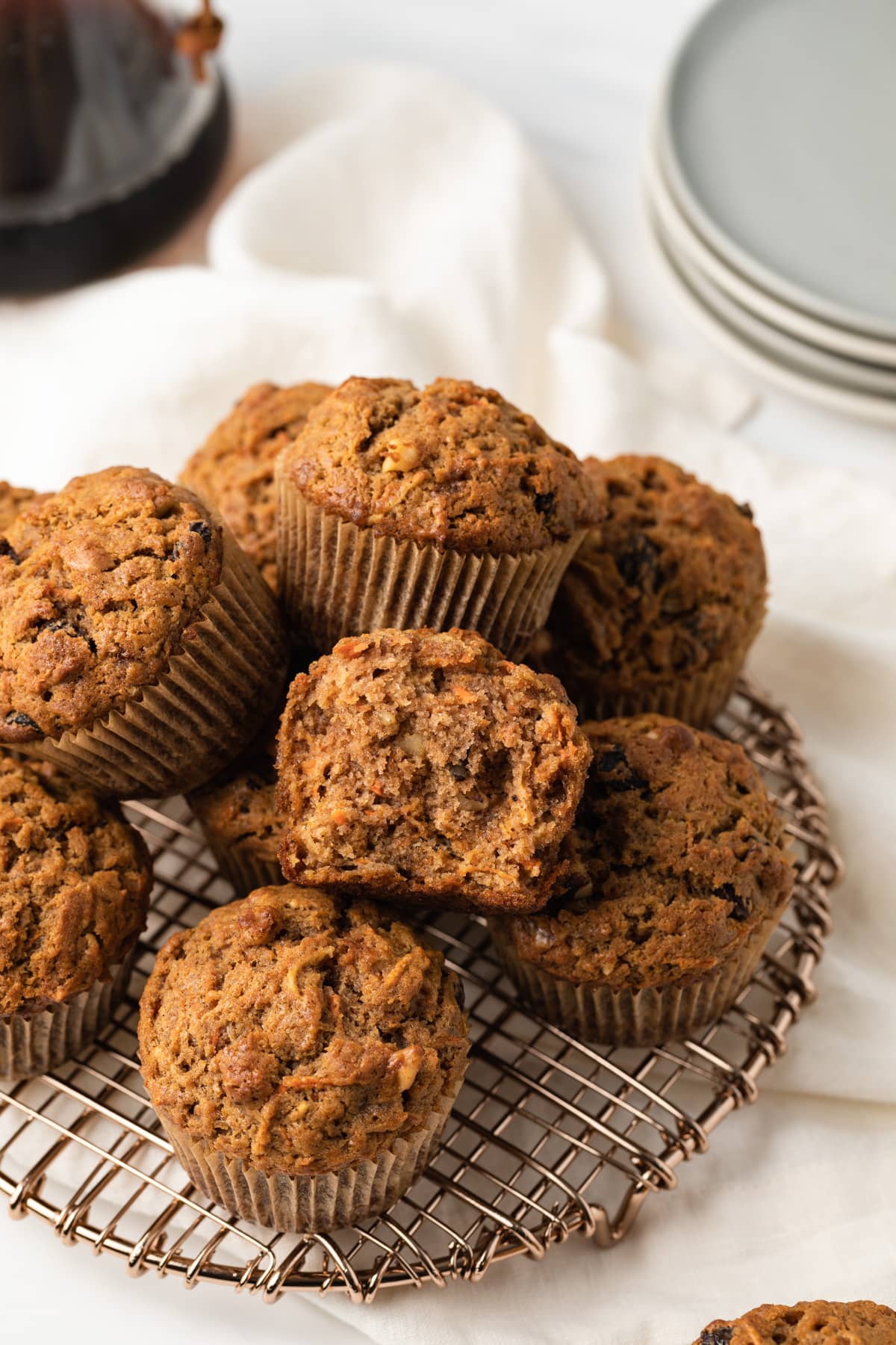 Morning glory muffins with one broken open.