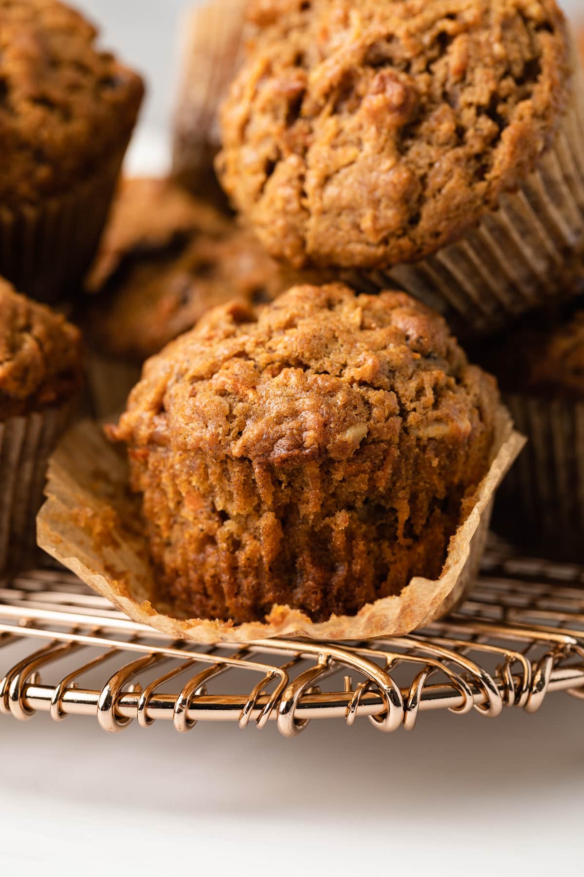 Closeup up morning glory muffin with paper liner torn away.