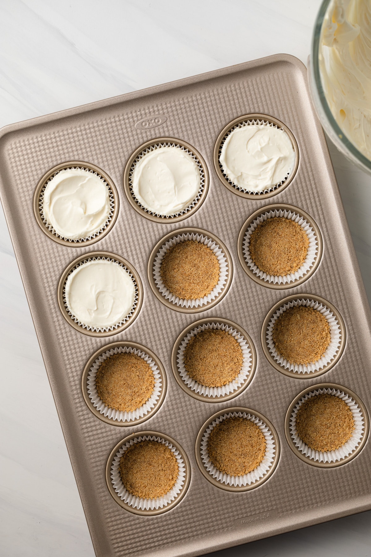 Filling added to crust in muffin pan.