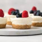 Close up of no bake mini cheesecakes on serving platter.