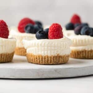 Close up of no bake mini cheesecakes on serving platter.