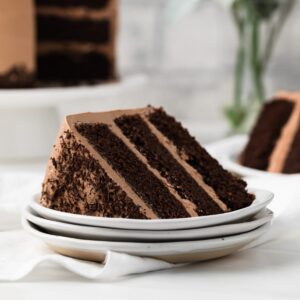 slice of Nutella cake on stack of three white plates
