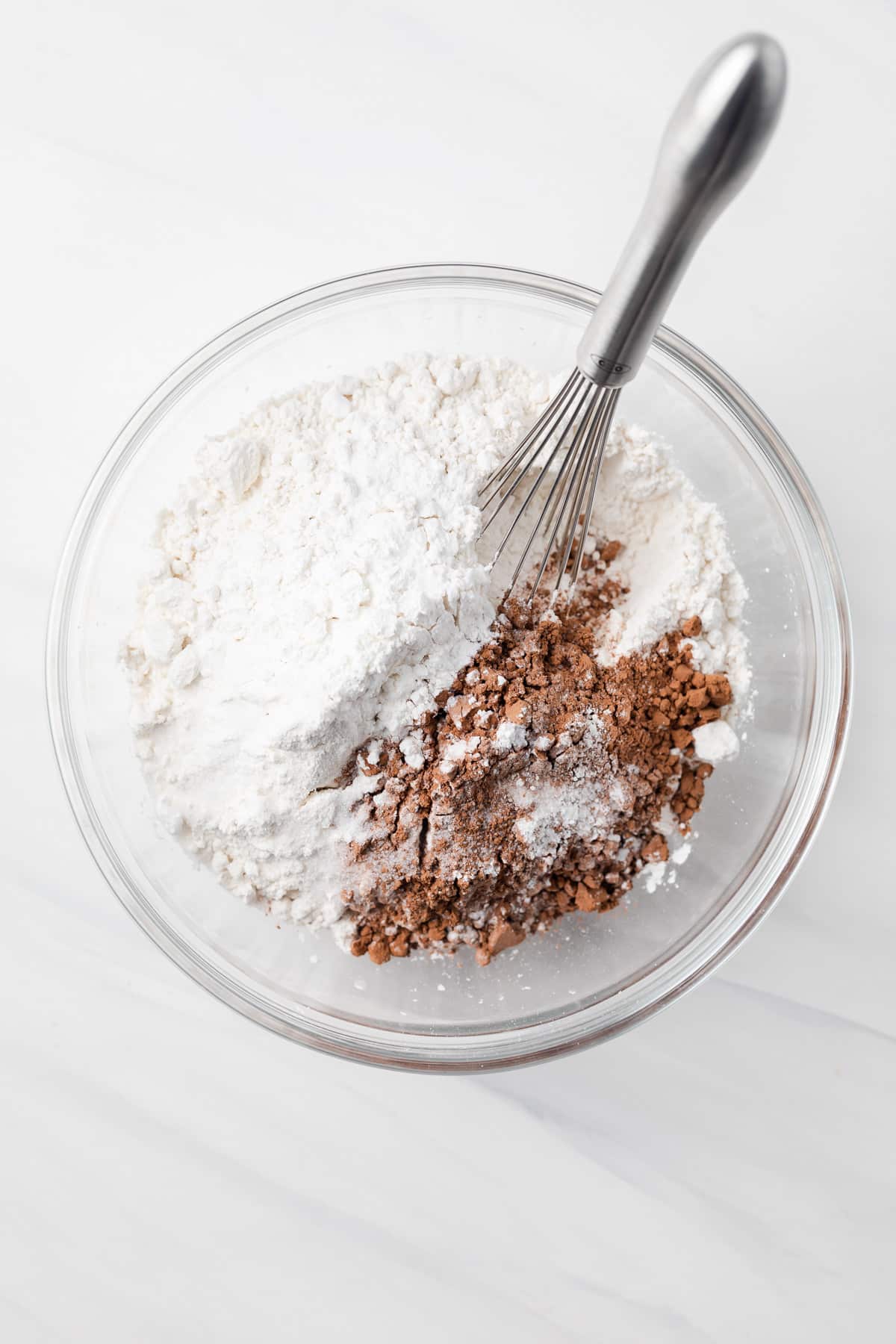 Dry ingredients mixed in glass bowl.