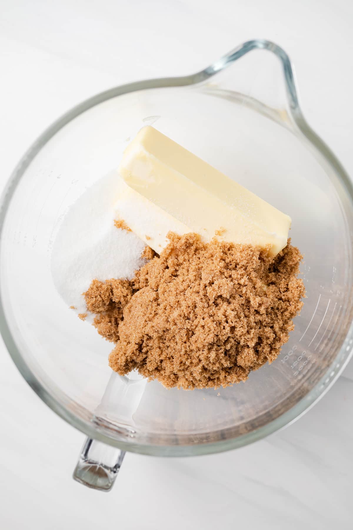 Butter and sugar in glass bowl.