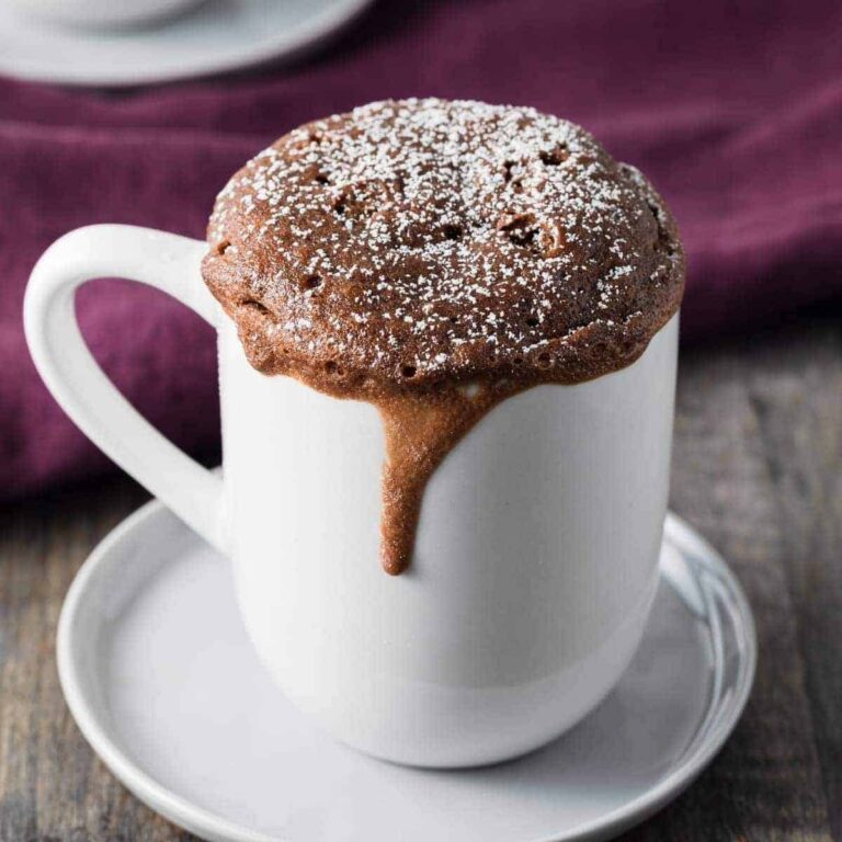 side view of Nutella mug cake in a white cup