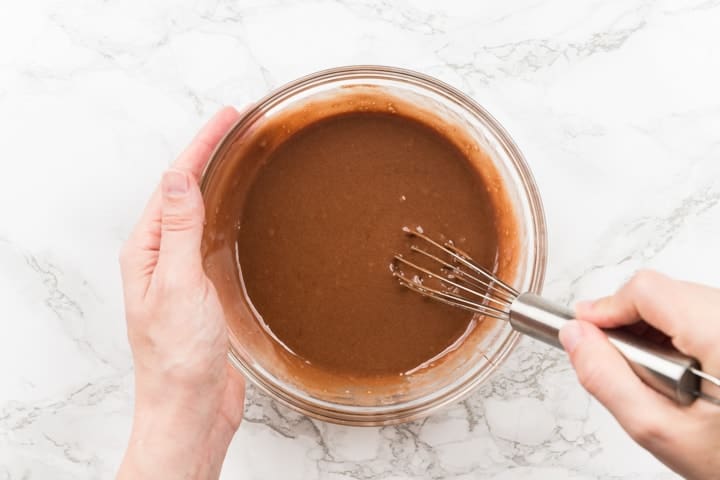 Nutella mug cake batter in glass bowl