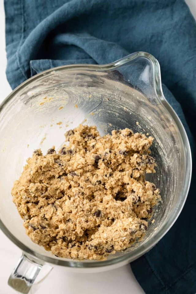 Oatmeal chocolate chip cookie dough in a mixing bowl