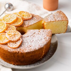 slice being taken out of orange chiffon cake
