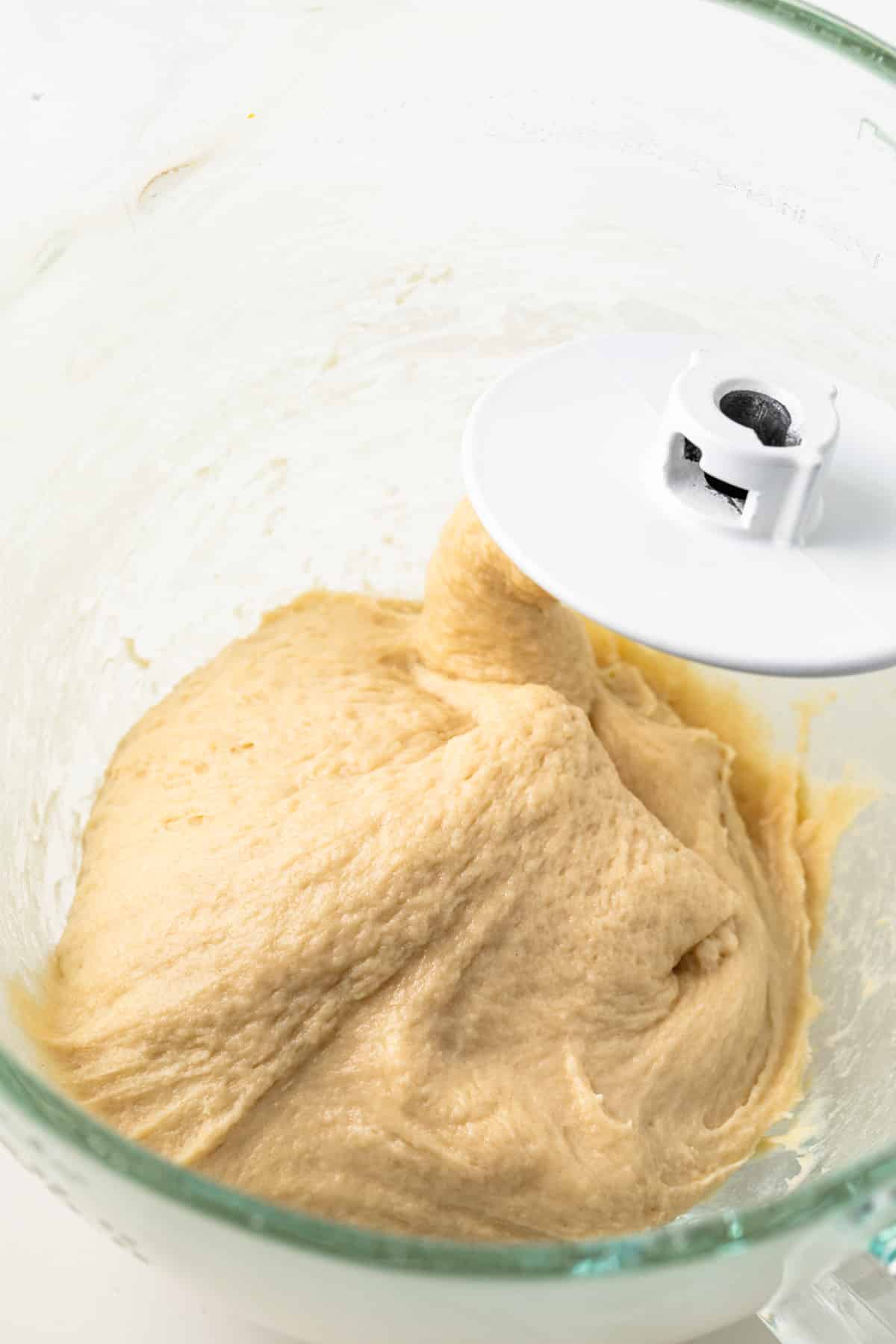 Dough in a glass bowl.