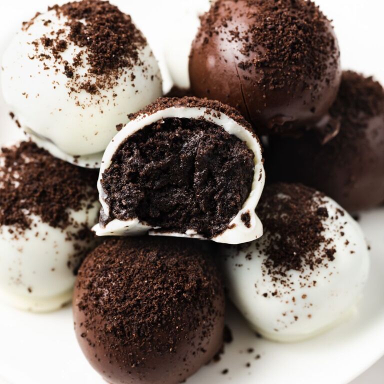 Close up of Oreo balls with bite taken out of one.