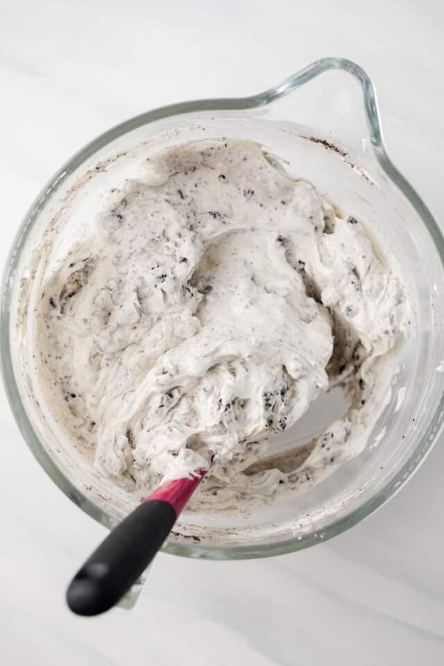 No bake Oreo cheesecake batter in mixing bowl.