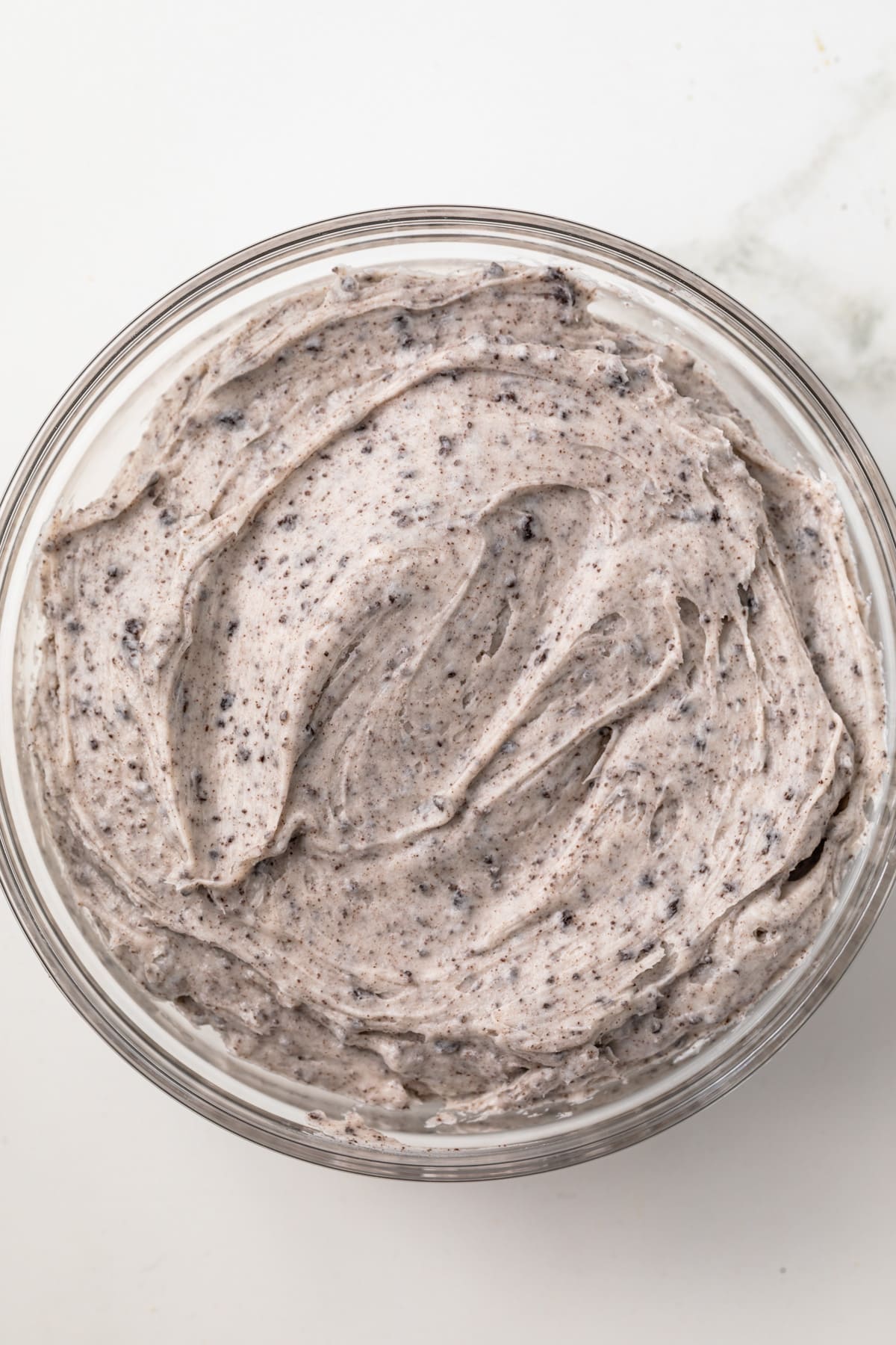 Oreo frosting in a glass bowl.